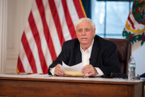 Justice touts tax plan, higher education initiative in COVID-19 briefing